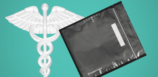Stash Proof Vacuum Seal Box next to staff of Caduceus