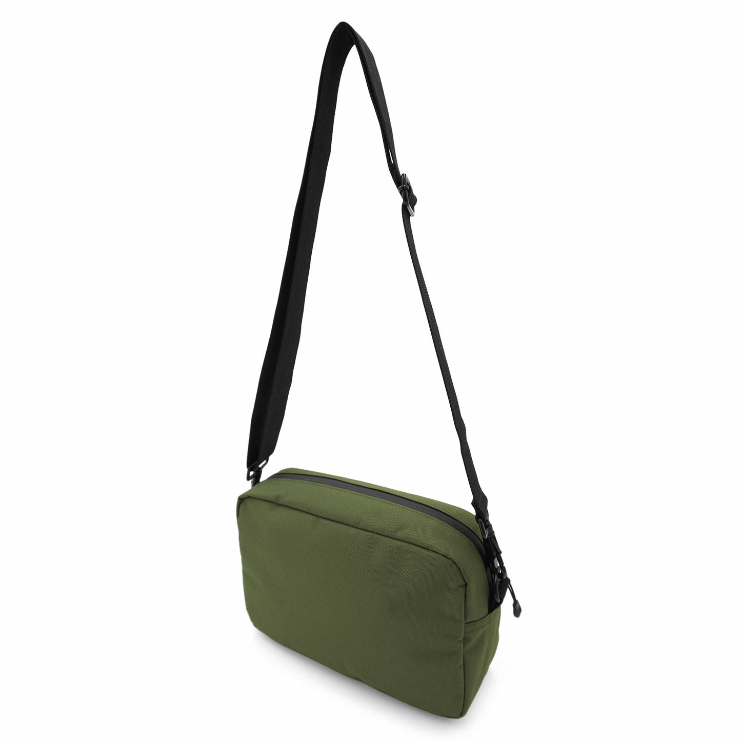 Back of the olive green Rover bag with shoulder strap being suspended in air