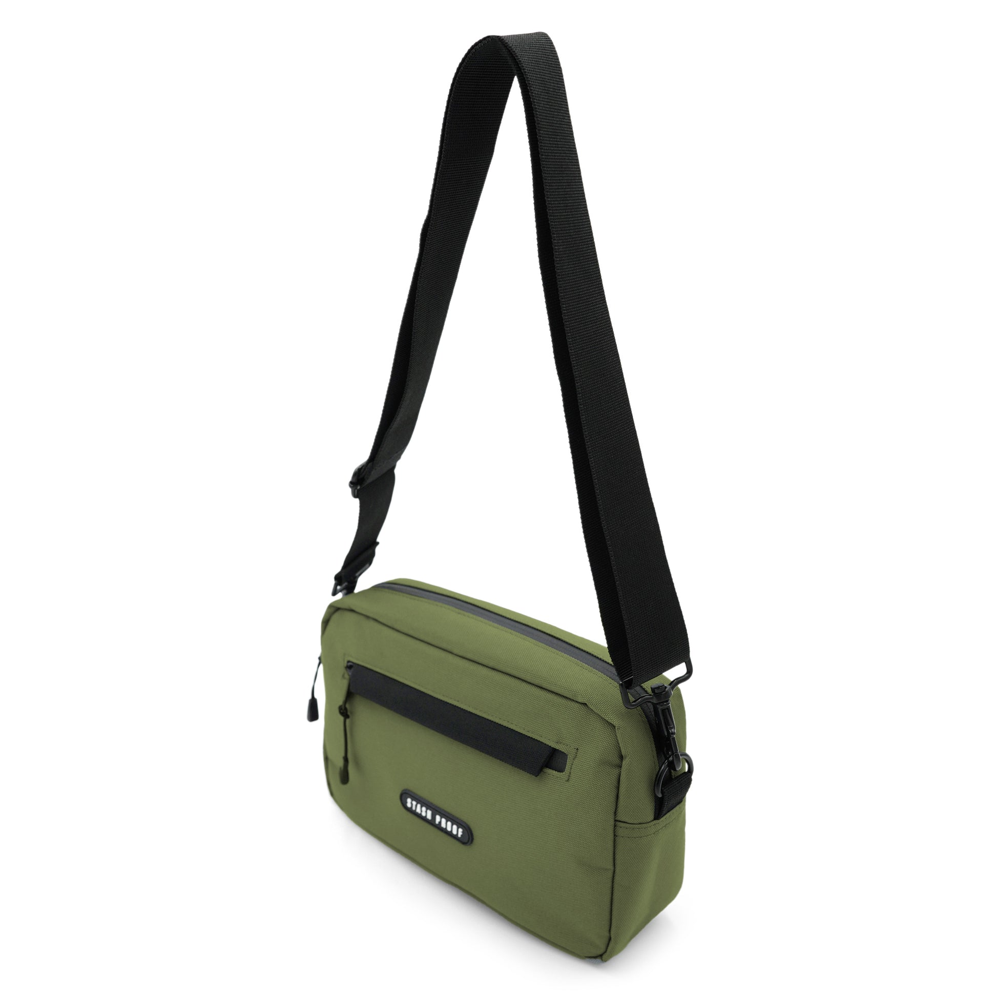 A green Rover bag made from polyester material with a black strap strap hanging in the air