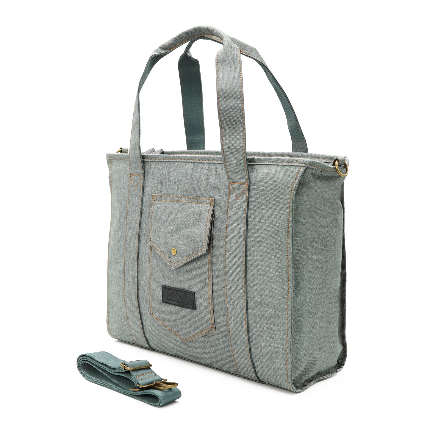 3/4 view of Tote bag with carrying strap laying beside it.