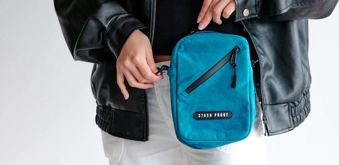 Woman unzipping waterproof zipper on blue stash bag