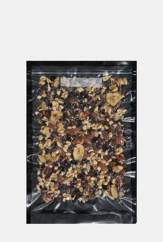 11 by 16 inch vacuum seal mix of dried fruits and nuts on a white background