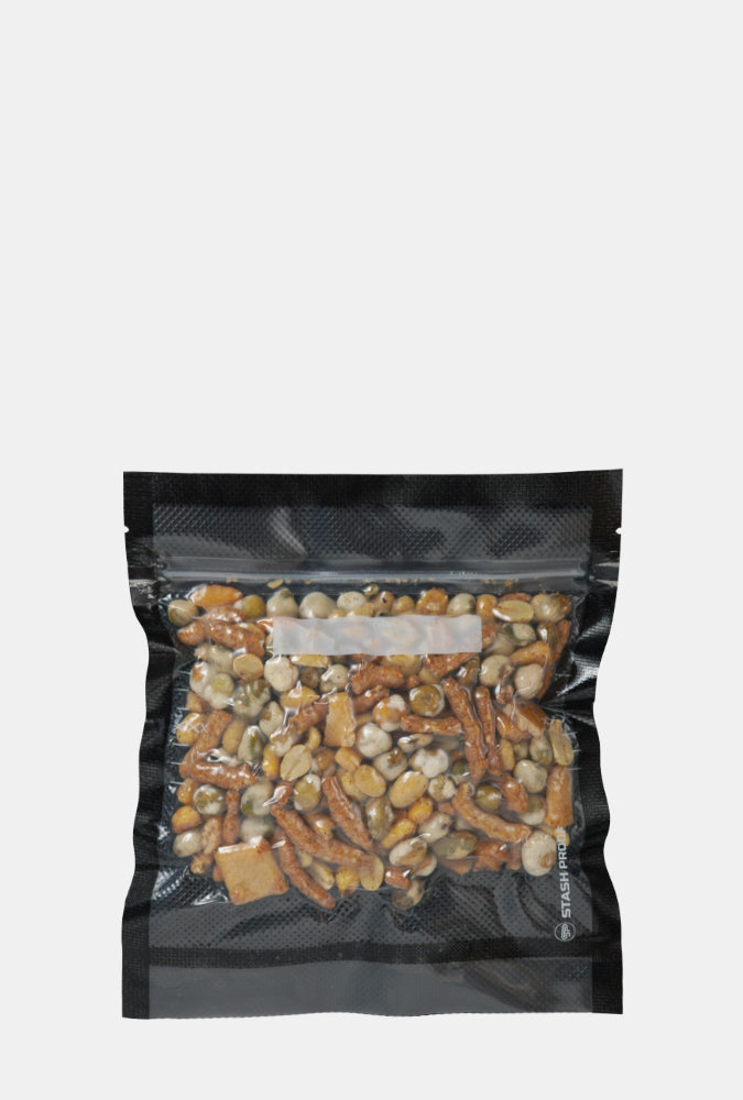 7 by 8 inch vacuum seal mix of dried fruits and nuts on a white background