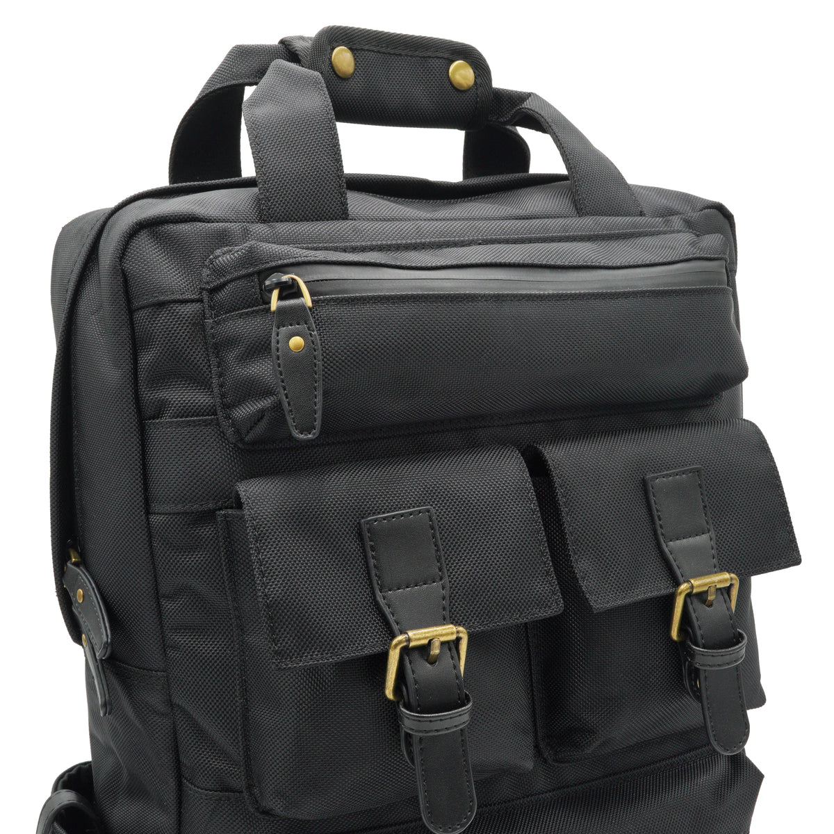 Close view of the black Runner backpack front pockets, buckle details, zipper, and brass-finish hardware