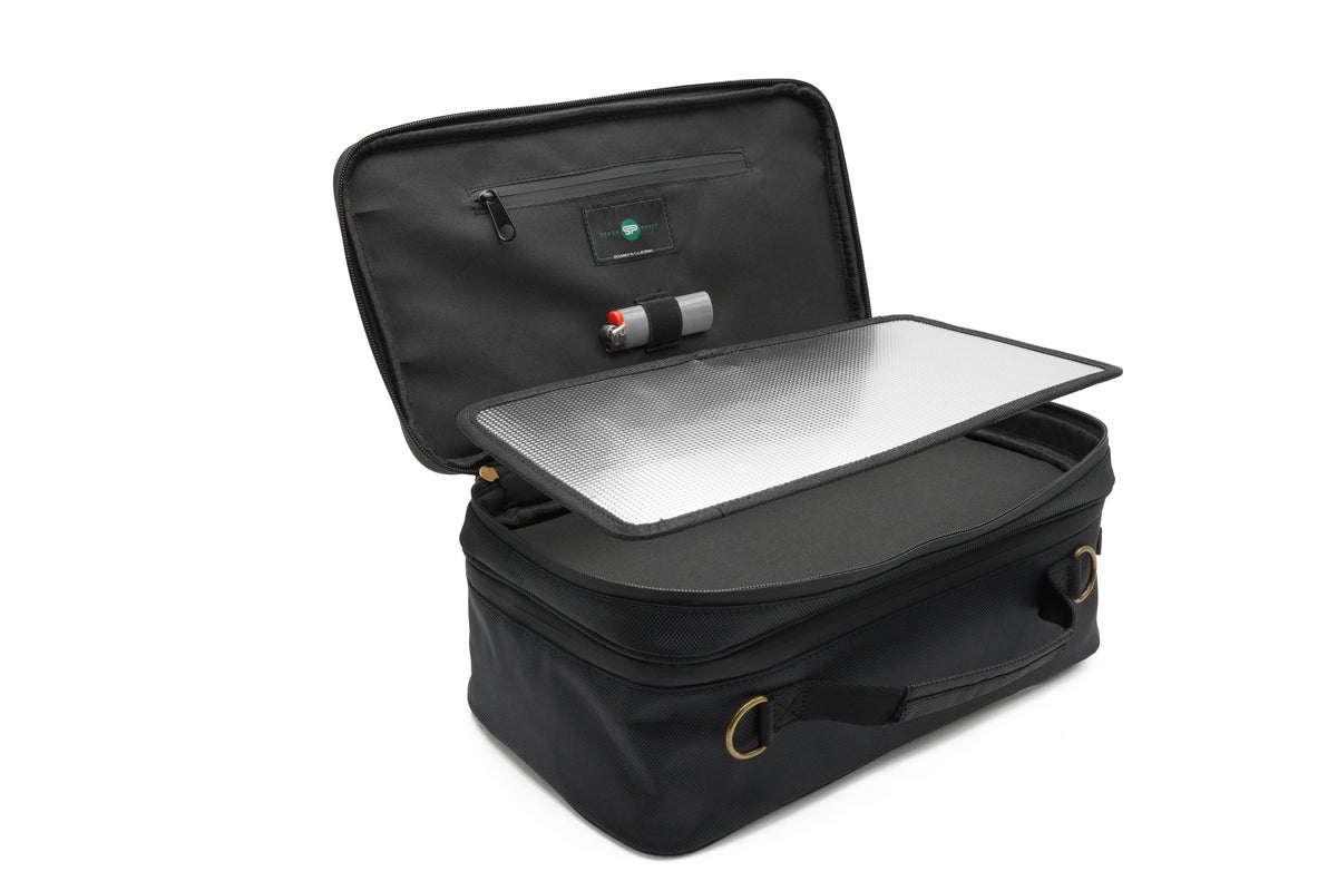 Open Stash Box showing the reflective removable tray and interior storage pockets