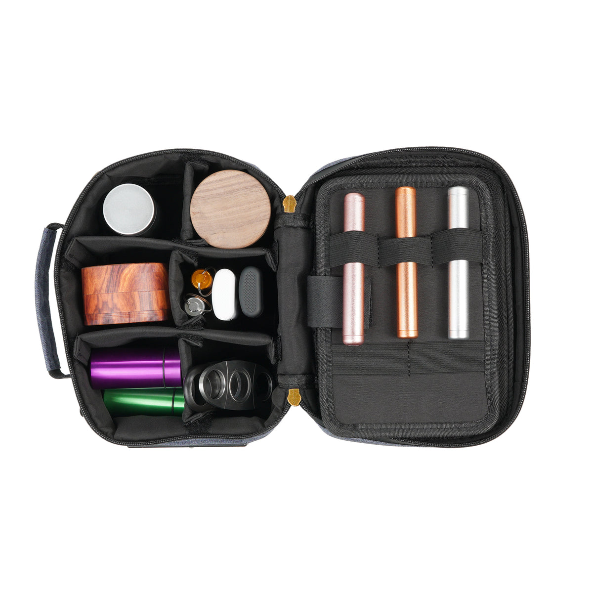 Open denim blue Stash Pack arranged with small containers, accessories, and personal essentials