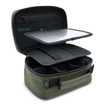 Green and black Stash Pack travel case showing removable organizers on a white background