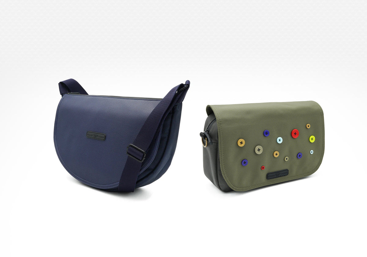 Two bags, one lowkey and one button bag with colorful buttons, on a white background.