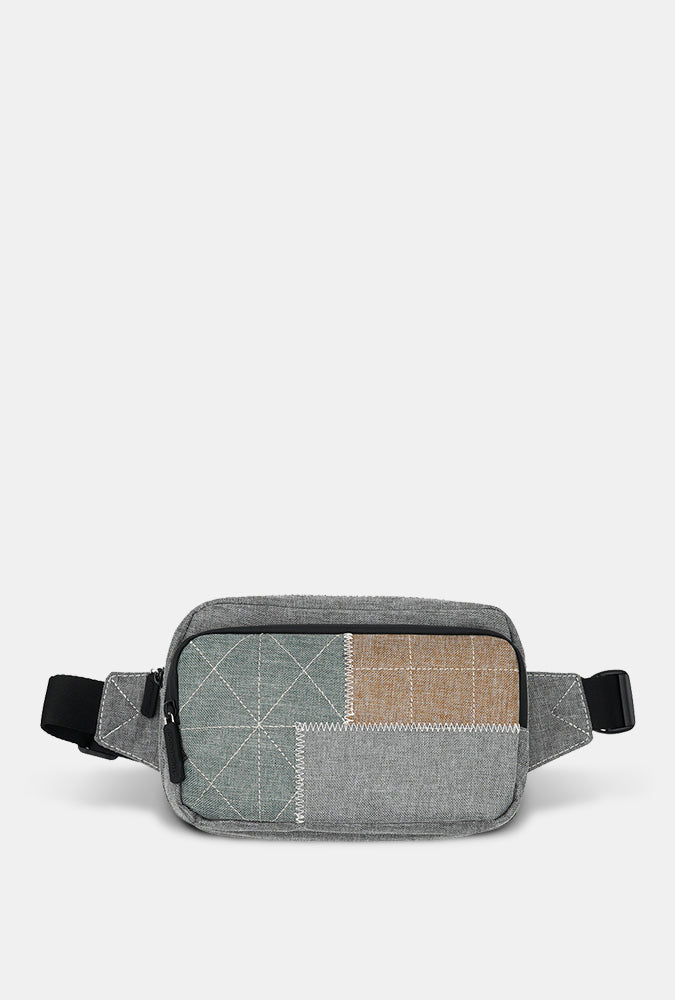 Gray patchwork waist bag on a light gray background