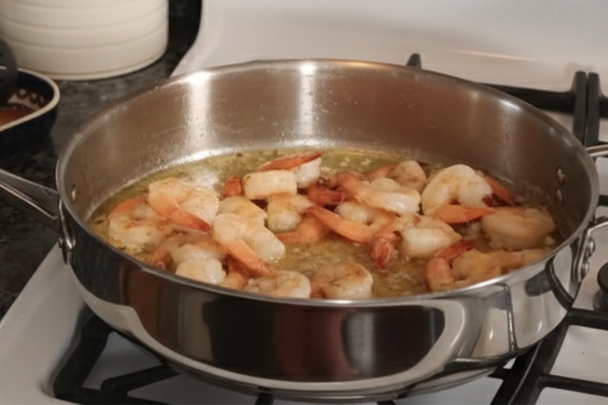 Shrimp cooking in a pan on a stove