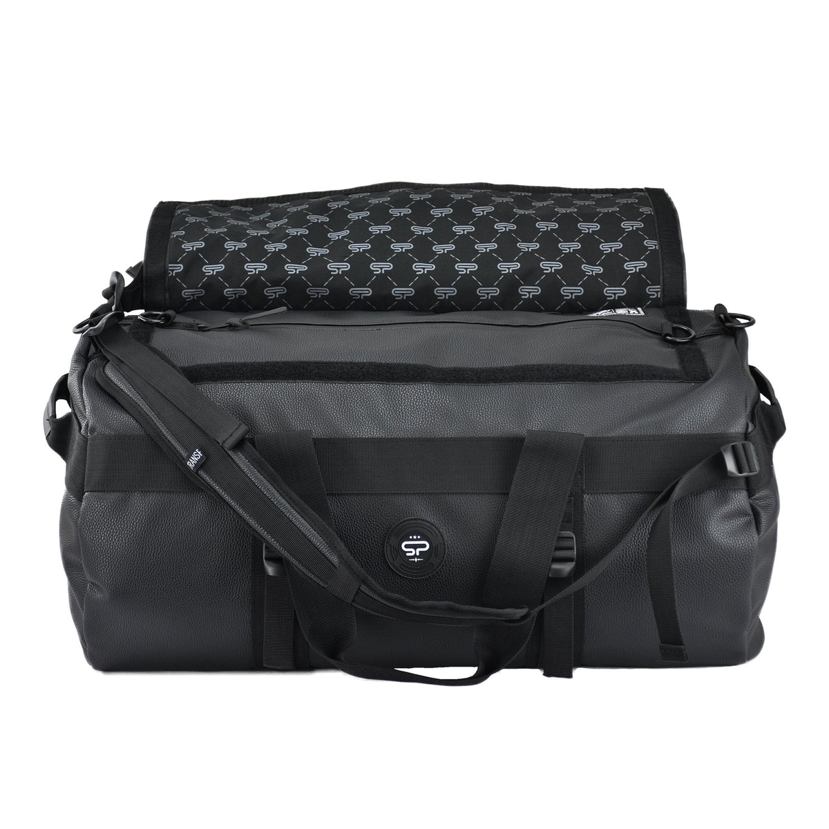 Open black Transporter L100 duffel showing the carbon-lined interior, zipper pocket, and shoulder straps