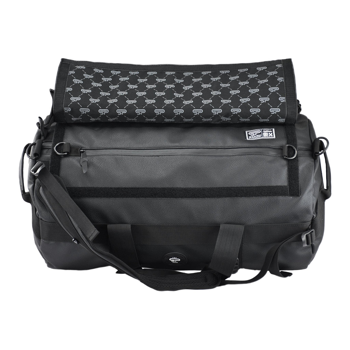Open black Transporter L100 duffel showing the patterned lining and long interior zipper pocket